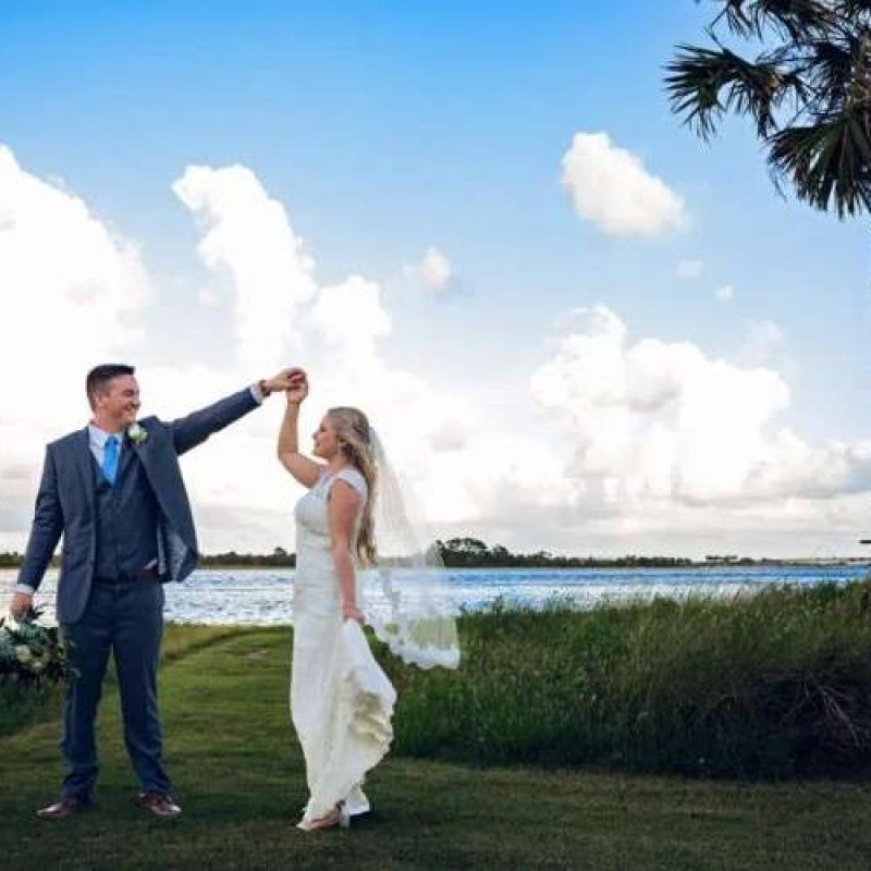 bride and groom with the intracoastal waterway at The Ribault Club
